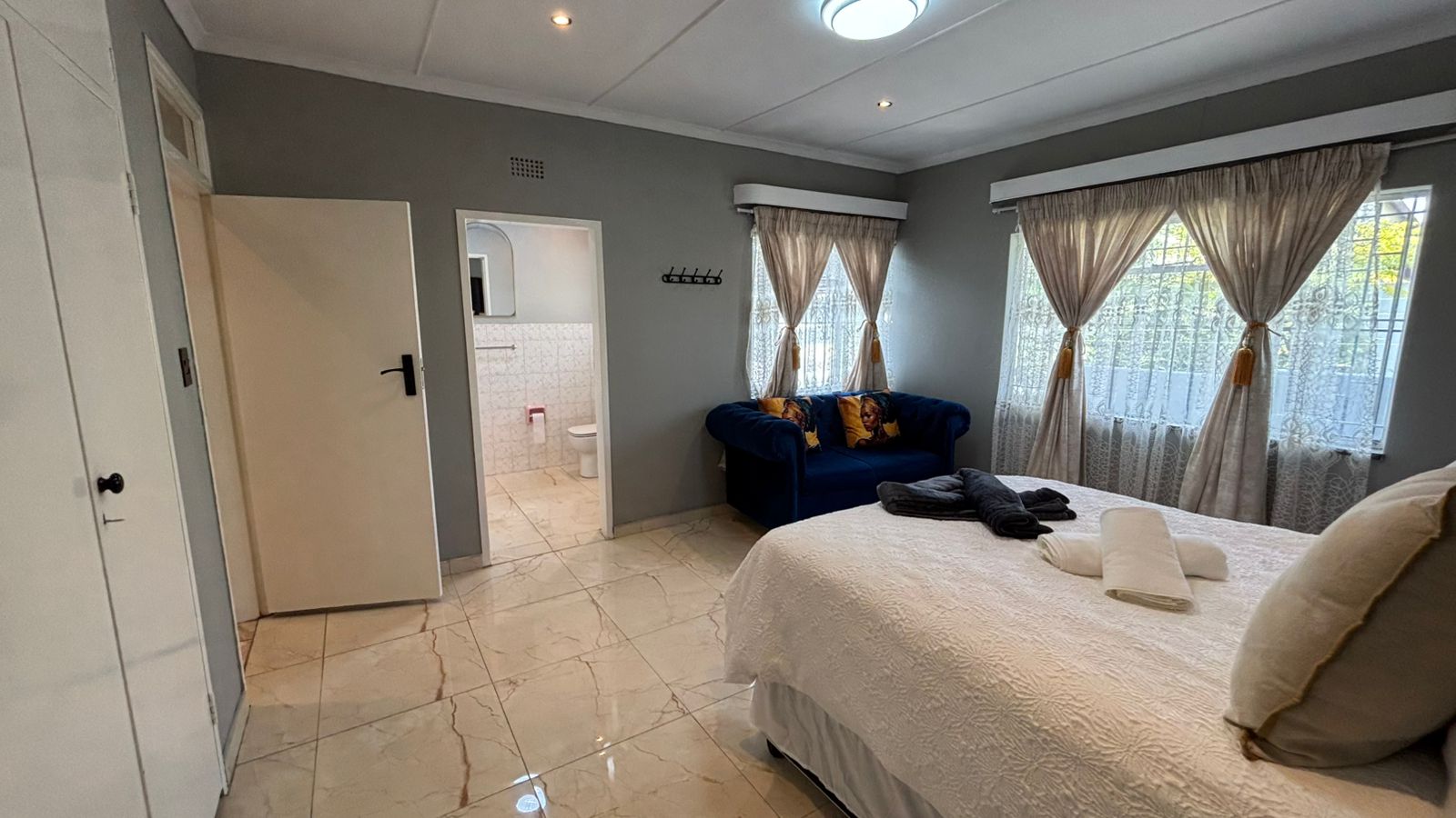 Main bedroom with couch at Bella Vista