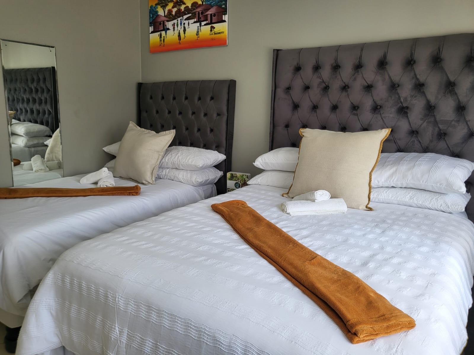 Second view of Room 2 with a double bed and single bed